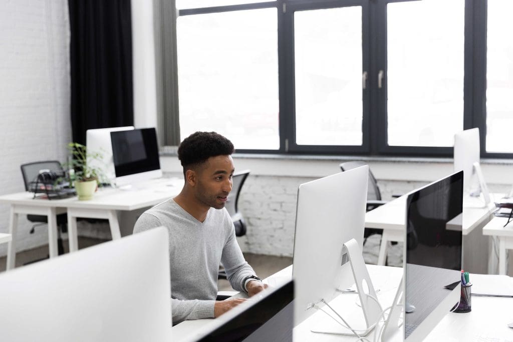Software Engineer working on his PC, software engineering is one of the highest paying engineering jobs in the United States